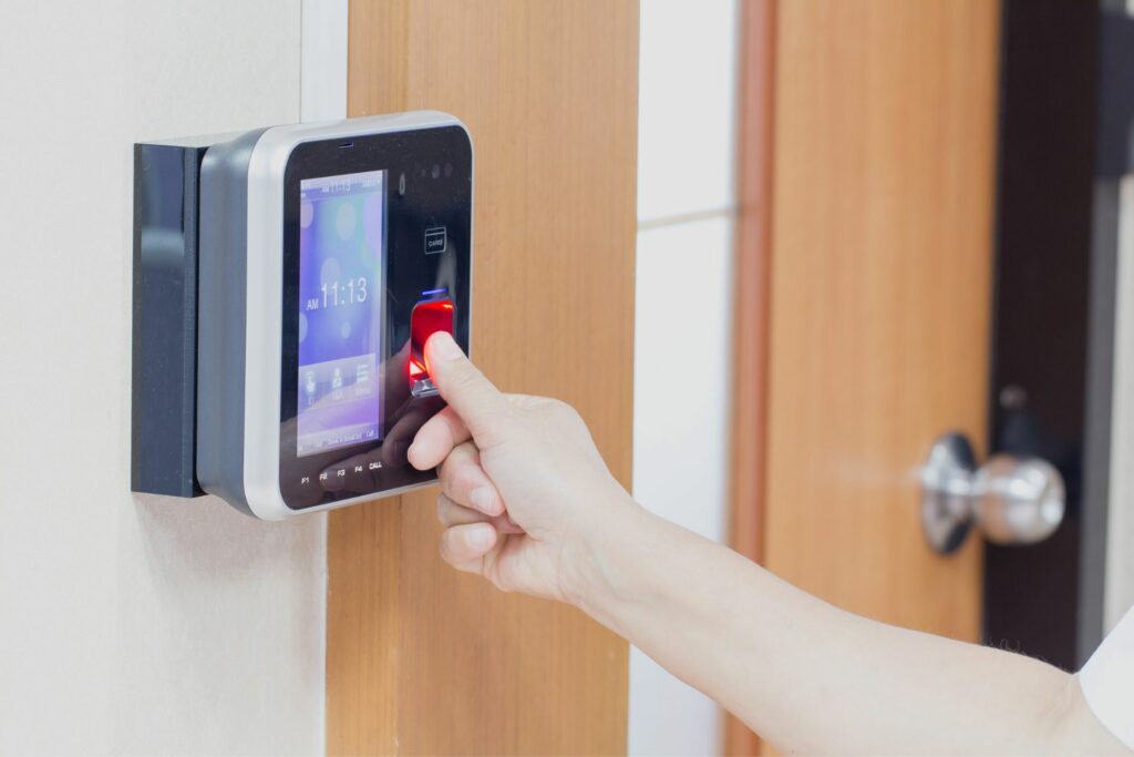 A person uses one of the three types of access control systems to enter a building.